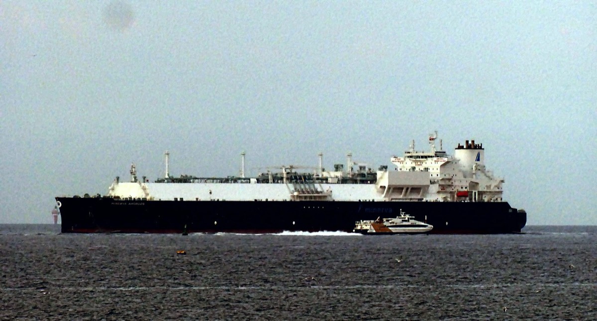 LNG carrier under escort by a tug